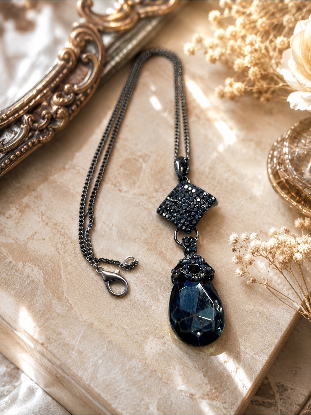 Black Crystal Teardrop Pendant Necklace in Gunmetal toned metal